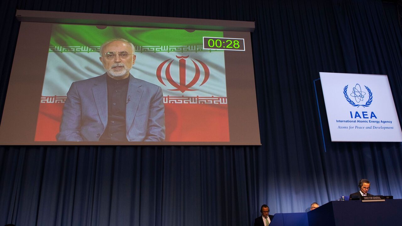 Rafael Grossi (R), Director General of the International Atomic Energy Agency (IAEA), listens to Iran's Atomic Energy Vice-President Ali Akbar Salehi, who attends virtually the 64th General Conference of the IAEA at the agency's headquarters in Vienna, Austria on September 21, 2020. (Photo by JOE KLAMAR / AFP) / The erroneous mention[s] appearing in the metadata of this photo by JOE KLAMAR has been modified in AFP systems in the following manner: [Ali Akbar Salehi] instead of [Zarif]. Please immediately rem