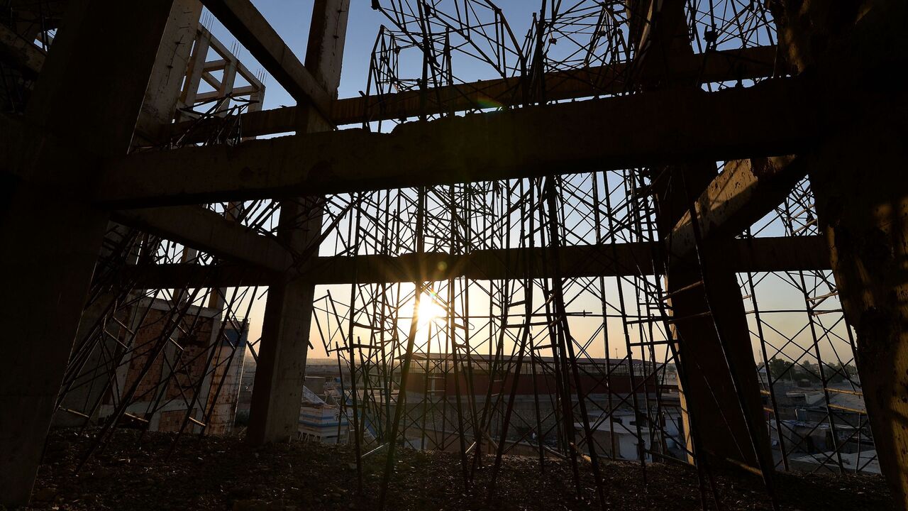 1229228375 TOPSHOT - A view shows the ravaged al-Idara al-Mahalia stadium, which was once used by Islamic State group fighters as a weapons depot, near the northern Iraqi city of Mosul on October 22, 2020. - Jihadi fighters from the Islamic State (IS) group seized Mosul in 2014, later expanding its so-called 'caliphate' to over a third of Iraq and into neighbouring Syria. In 2017, Iraqi and coalition forces forced the hardened insurgents out in a grinding urban battle that left the ancient city in ruins. The bullet-ri