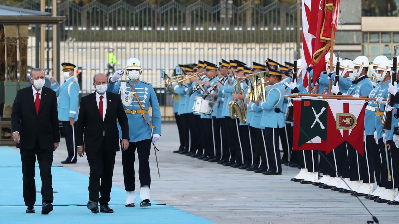 1229293115 President of Turkey Recep Tayyip Erdogan (L) welcomes Turkish-Cypriot leader Ersin Tatar (R) during an official ceremony in Ankara, on October 26, 2020. - Ankara-backed Ersin Tatar, the newly elected Turkish Cypriot leader, makes his first official visit in Ankara on October 26, 2020. (Photo by Adem ALTAN / AFP) (Photo by ADEM ALTAN/AFP via Getty Images)