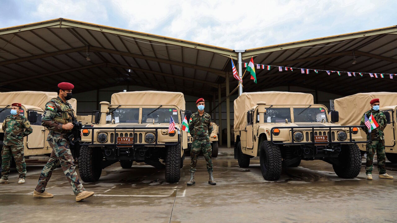 1229561333 Members of the Iraqi-Kurdish Peshmerga forces attend a handover and US military and logistic assistance distribution ceremony to the Peshmerga Ministry of the Kurdistan Regional Government (KRG) in the Arbil the capital of the autonomous Kurdish region in northern Iraq on November 10, 2020. (Photo by SAFIN HAMED / AFP) (Photo by SAFIN HAMED/AFP via Getty Images)
