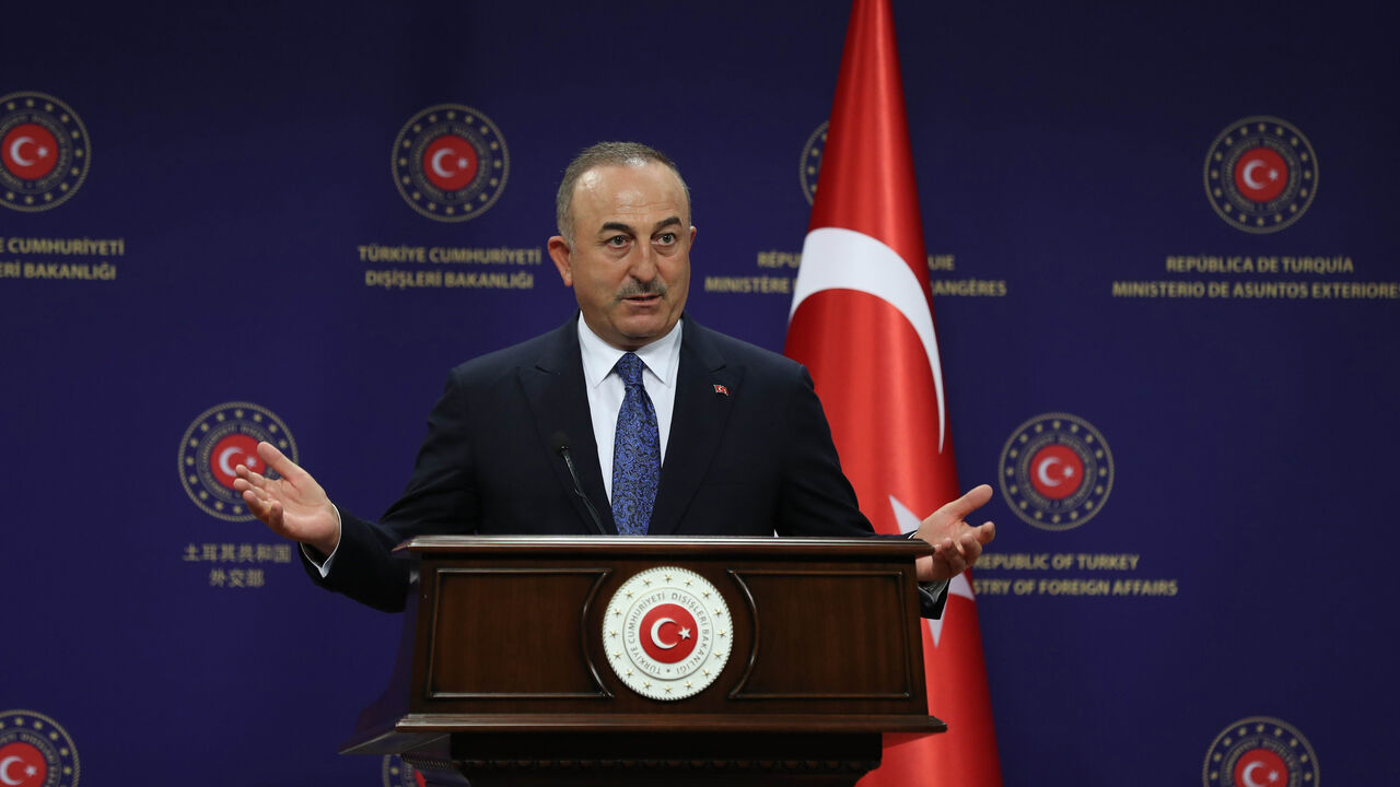 1230008390 Turkish Foreign minister Mevlut Cavusoglu gives a press conference with his Hungarian counterpart following their meeting in Ankara, on December 8, 2020. (Photo by Adem ALTAN / AFP) (Photo by ADEM ALTAN/AFP via Getty Images)