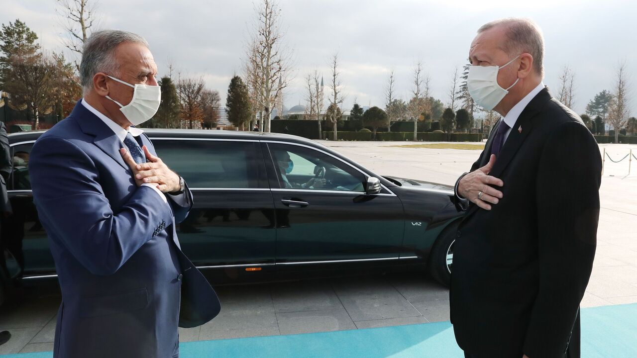 1230180597 A handout picture taken and released on December 17 , 2020 by the Turkish Presidential Press service shows Turkish President Recep Tayyip Erdogan (R) welcomes Iraqi Prime Minister Mustafa Al-Kadhimi (L) at the Presidential Complex with an official ceremony in Ankara. (Photo by Murat CETINMUHURDAR / TURKISH PRESIDENTIAL PRESS SERVICE / AFP) / XGTY / RESTRICTED TO EDITORIAL USE - MANDATORY CREDIT "AFP PHOTO / TURKISH PRESIDENTIAL PRESS SERVICE/ MURAT CETINMUHURDAR" - NO MARKETING - NO ADVERTISING CAMPAIGNS -