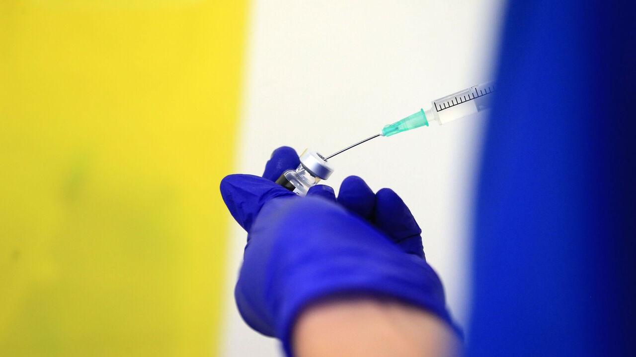 1230259018 Nurse Practitioner Terri Welch prepares a dose of the Pfizer-BioNTech Covid-19 vaccine, at the Haxby and Wigginton Group Medical Practice in Haxby, northern England on December 22, 2020. - Europe is expected to start a massive vaccination campaign after Christmas following the United States and Britain, which have begun giving jabs with an approved Pfizer-BioNTech shot, one of several leading candidates. (Photo by Lindsey Parnaby / AFP) (Photo by LINDSEY PARNABY/AFP via Getty Images)