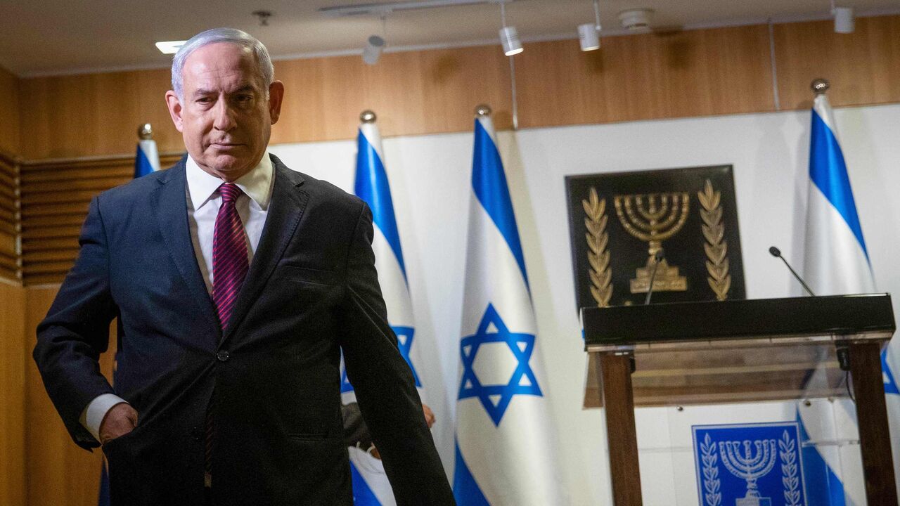 1230264493 Israeli Prime Minister Benjamin Netanyahu leaves after a speech at the Knesset (Israeli Parliament) in Jerusalem on December 22, 2020. (Photo by Yonathan SINDEL / POOL / AFP) (Photo by YONATHAN SINDEL/POOL/AFP via Getty Images)