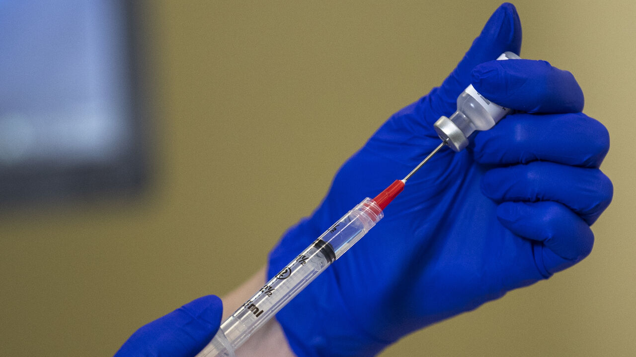 1291818173 WASHINGTON, DC - DECEMBER 17: The Pfizer-BioNTech COVID-19 vaccine being prepared prior to a vaccine event at Kaiser Permanente Capitol Hill Medical Center on December 17, 2020 in Washington, DC. (Photo by Shawn Thew-Pool/Getty Images)