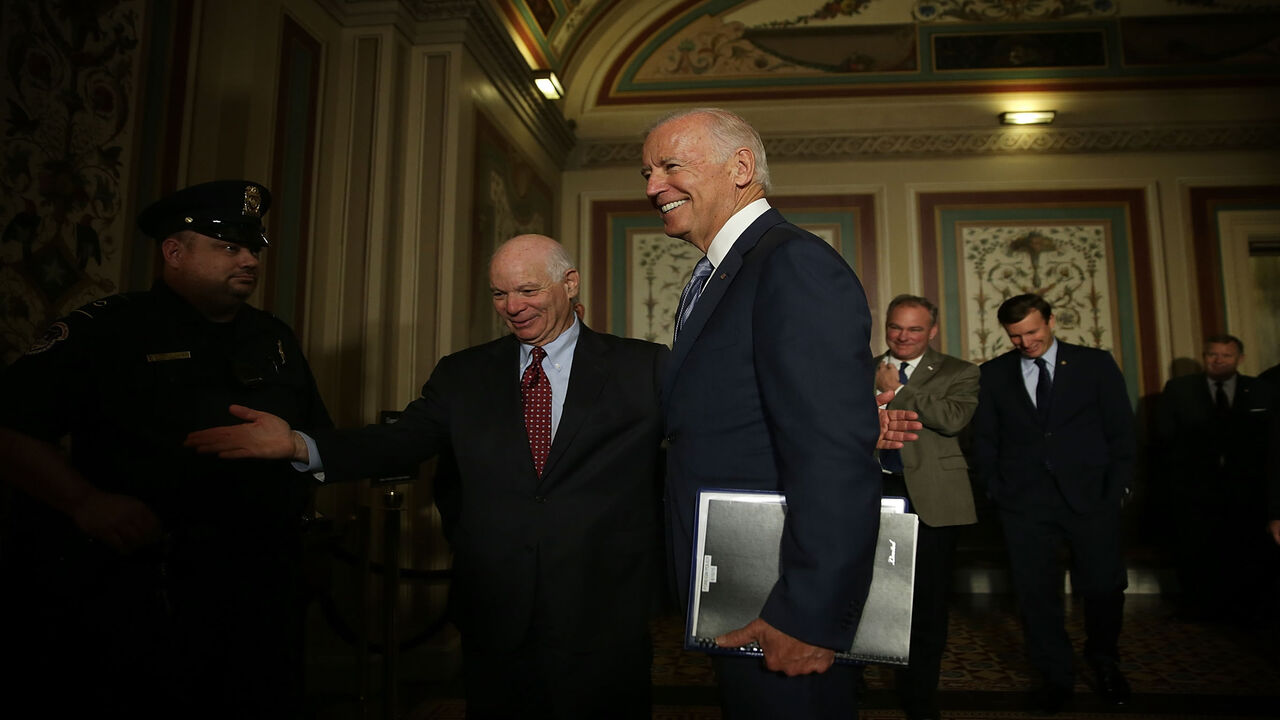 480933550 WASHINGTON, DC - JULY 16: U.S. Vice President Joseph Biden (2nd L) arrives at a meeting with Senate Foreign Relations Committee members as he is welcomed by Sen. Ben Cardin (D-MD) (L) July 16, 2015 at the U.S. Capitol in Washington, DC. Vice President Biden was on the Hill to pitch the Iran nuclear deal. Sen. Tim Kaine (D-VA) (3rd L) and Sen. Chris Murphy (D-CT) (4th L) also attended the meeting. (Photo by Alex Wong/Getty Images)