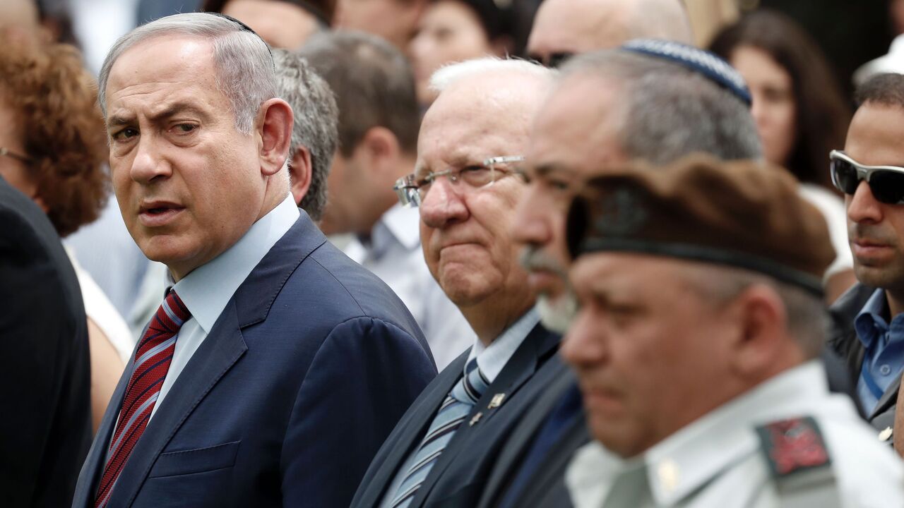 577563510 (From L to R) Israeli Prime Minister Benjamin Netanyahu, Israeli President Reuven Rivlin, Israeli Defense Minister Avigdor Lieberman and Israeli Chief of Staff General Gadi Eizenkot attend an official memorial ceremony marking the tenth anniversary of the 2006 war between Israel and Lebanon's Hezbollah movement, at the military cemetery of Mount Herzl in Jerusalem on July 19, 2016.
Israel is marking a decade since its 2006 war with its "main enemy" Hezbollah, but the Lebanese militia's involvement in Syria