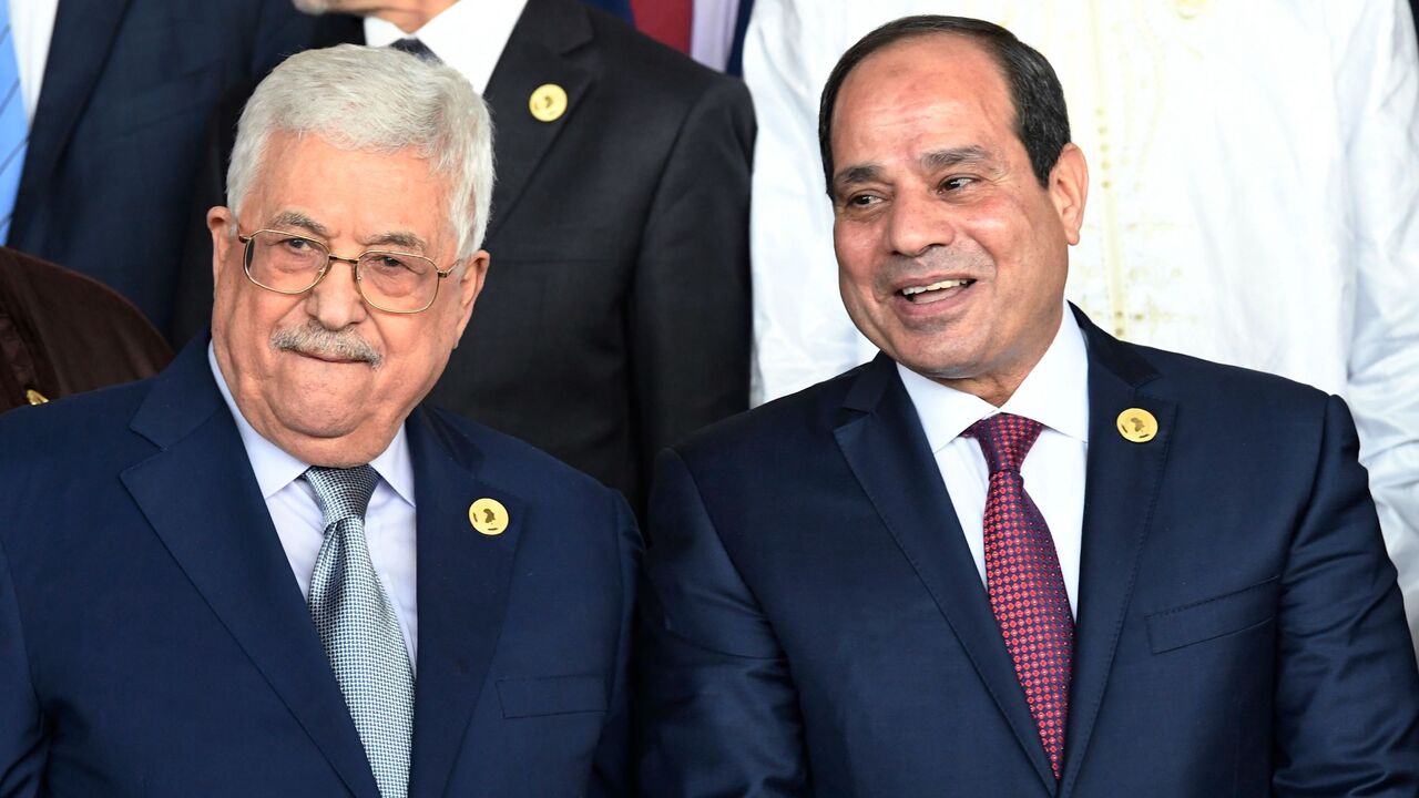 911395532 Egyptian President Abdel Fattah al-Sisi (R) speaks with with Palestinian President Mahmoud Abbas as they pose for a family a photo at the opening of the Ordinary Session of the Assembly of Heads of State and Government during the 30th annual African Union summit in Addis Ababa on January 28, 2018. / AFP PHOTO / SIMON MAINA (Photo credit should read SIMON MAINA/AFP via Getty Images)