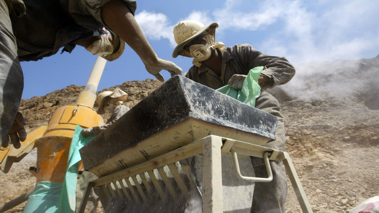 102845866 Egyptian workers manipulate mineral samples from a gold mine at Marsa Alam, in the Red Sea hills, 14 September 2006. After a 2,000-year lapse, Egypt is looking to acquire a gold-mining industry again by reviving ancient deposits of the precious mineral that symbolised the glory of the Pharaohs. AFP PHOTO/KHALED DESOUKI (Photo credit should read KHALED DESOUKI/AFP via Getty Images)