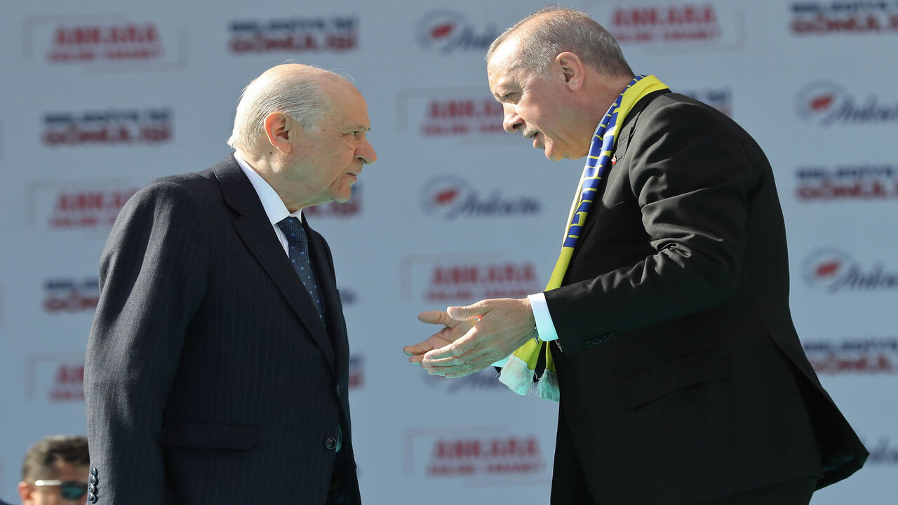 1132195429 Turkey's President Tayyip Erdogan (R) and leader of the Nationalist Movement Party (MHP) Devlet Bahceli talk on stage during a rally for the upcoming local elections in Ankara, Turkey, on March 23, 2019. - Turkish will cast their ballots for local elections on March 31, 2019. (Photo by Adem ALTAN / AFP) (Photo credit should read ADEM ALTAN/AFP via Getty Images)