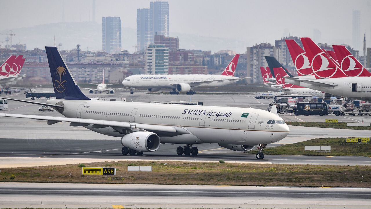 1134822904 A Saudi Arabian Airlines Saudia plane is pictured on the tarmac of the Ataturk Airport on April 4, 2019, in Istanbul. - A transfer of Istanbul's Ataturk airport operations to its new international facility will begin at April 6 early morning. (Photo by OZAN KOSE / AFP) (Photo credit should read OZAN KOSE/AFP via Getty Images)