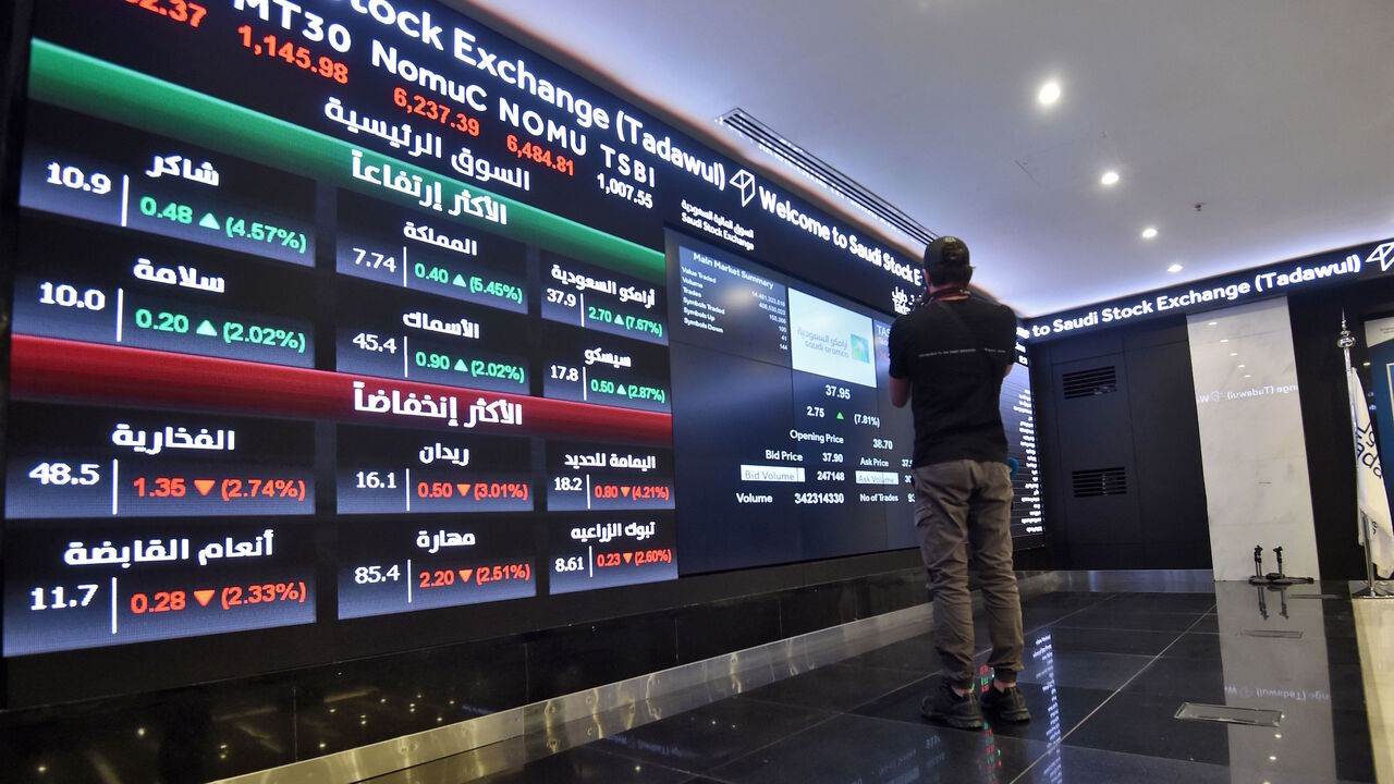1188080179 This picture taken December 12, 2019 shows a view of the board at the Stock Exchange Market (Tadawul) bourse in Riyadh. - Energy giant Saudi Aramco's market value soared above $2 trillion as its share price surged again on its second day of trading. The valuation milestone was sought by Saudi Crown Prince Mohammed bin Salman when he first floated the idea of selling up to five percent of Aramco, the world's largest oil firm, about four years ago. Aramco shares jumped another 9.7 percent to 38.60 riyals ($10