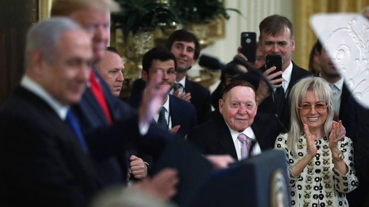 1202580395 WASHINGTON, DC - JANUARY 28: U.S. President Donald Trump and Israeli Prime Minister Benjamin Netanyahu participate in an East Room event at the White House as Founder, Chairman and CEO of Las Vegas Sands Sheldon Adelson and his wife Miriam Ochsorn look on January 28, 2020 in Washington, DC. President Trump released details of his administration's long-awaited Middle East peace plan to resolve the Israeli-Palestinian conflict. (Photo by Alex Wong/Getty Images)