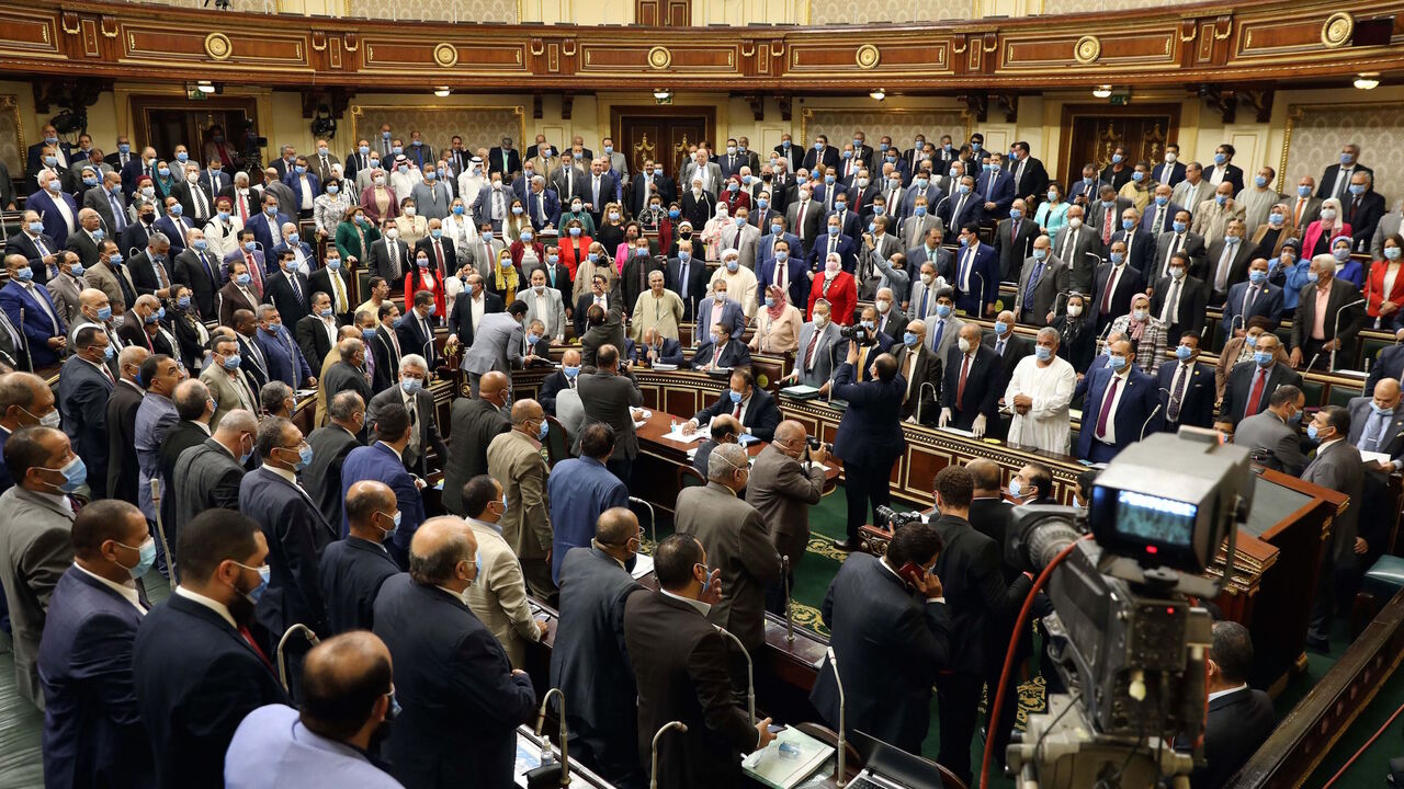 1227707917 Egyptian parliament members attend a general session in the capital Cairo on July 20, 2020. - Egypt's parliament greenlighted behind a closed-doors session later today, the possible deployment of troops in Libya to support Cairo's ally Khalifa Haftar, if rival Turkish-backed forces recapture the city of Sirte, the house said. (Photo by - / AFP) (Photo by -/AFP via Getty Images)