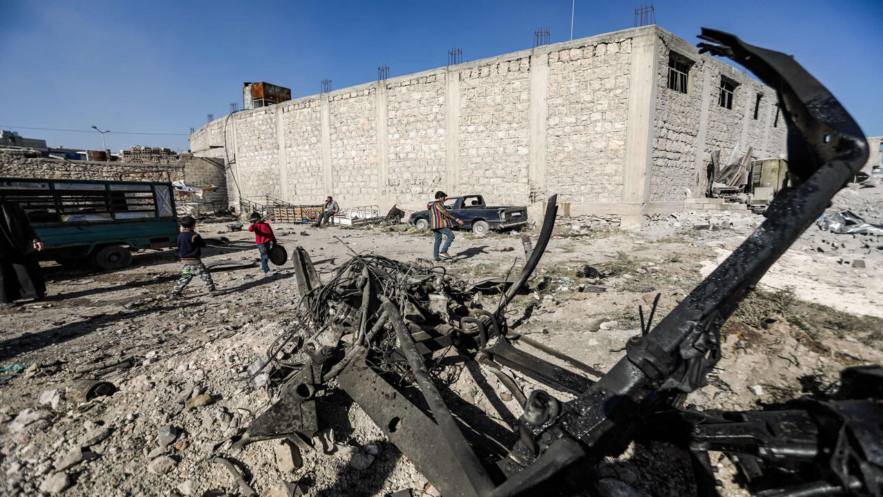 1229763986 People inspect the scene of a car bomb in the Turkish-controlled town of al-Bab in the north of Syria's Aleppo province on November 24, 2020. - The explosion, which targeted a police station on the outskirts of the town, killed a police chief from another station, two policemen and two civilians, the Britain-based Syrian Observatory for Human Rights reported. (Photo by Bakr ALKASEM / AFP) (Photo by BAKR ALKASEM/AFP via Getty Images)