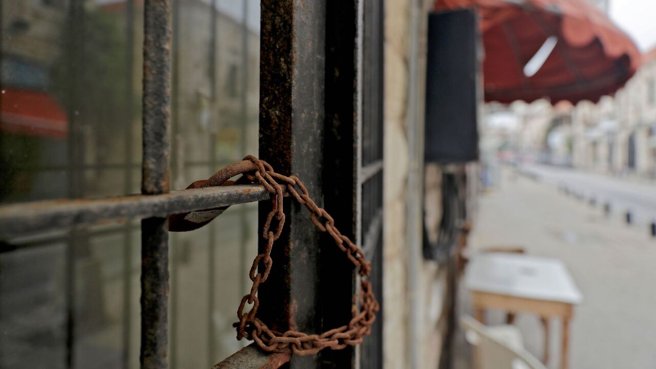 1229886773 A picture shows a closed shop in the city of Jounieh north ofBeirut on December 01, 2020. - Lebanon's economy is sinking into a "deliberate depression", the World Bank said on December 1 in a damning report stressing the authorities' failure to tackle the crisis. Lebanon's economy started collapsing last year as a result of years of corrupt practices and mismanagement. The crisis was made worse by a nationwide wave of anti-government protests that paralysed the country late last year and the Covid-19 pandem