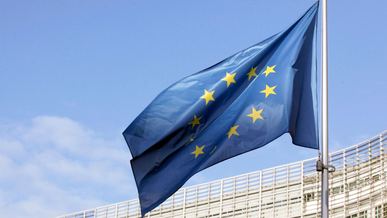 1230297135 In this picture taken on December 25, 2020 a flag of the European Union can be seen fluttering outside the European commission headquarters in Brussels. (Photo by François WALSCHAERTS / AFP) (Photo by FRANCOIS WALSCHAERTS/AFP via Getty Images)