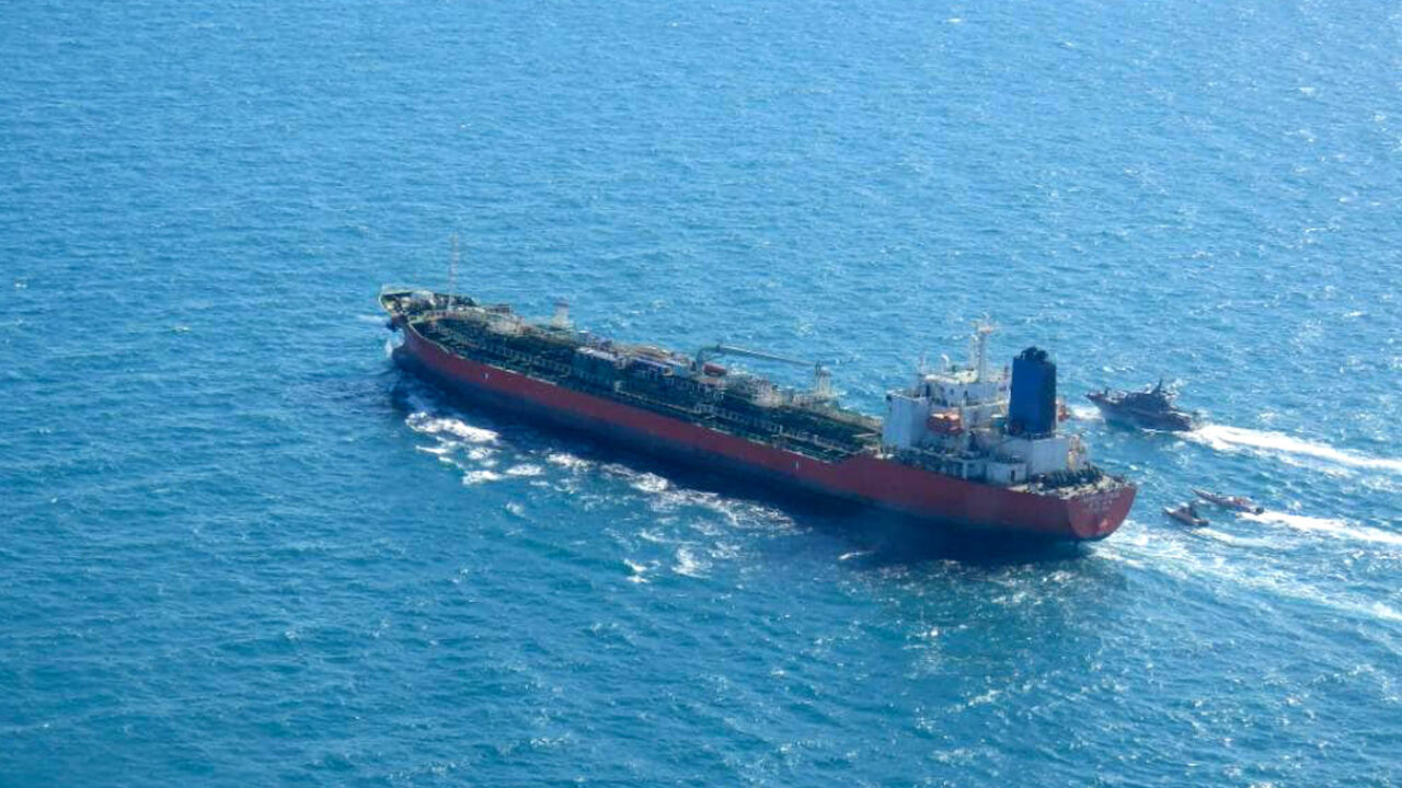 1230420179 A picture obtained by AFP from the Iranian news agency Tasnim on January 4, 2021, shows the South Korean-flagged tanker being escorted by Iran's Revolutionary Guards navy after being seized in the Gulf. - "A Korean ship was seized in Persian Gulf waters by the Revolutionary Guard's navy and transferred to our country's ports," Fars news agency said without naming the vessel. "This tanker had a South Korea flag and was seized over oil pollution and environmental hazards," it added. (Photo by - / TASNIM NEWS