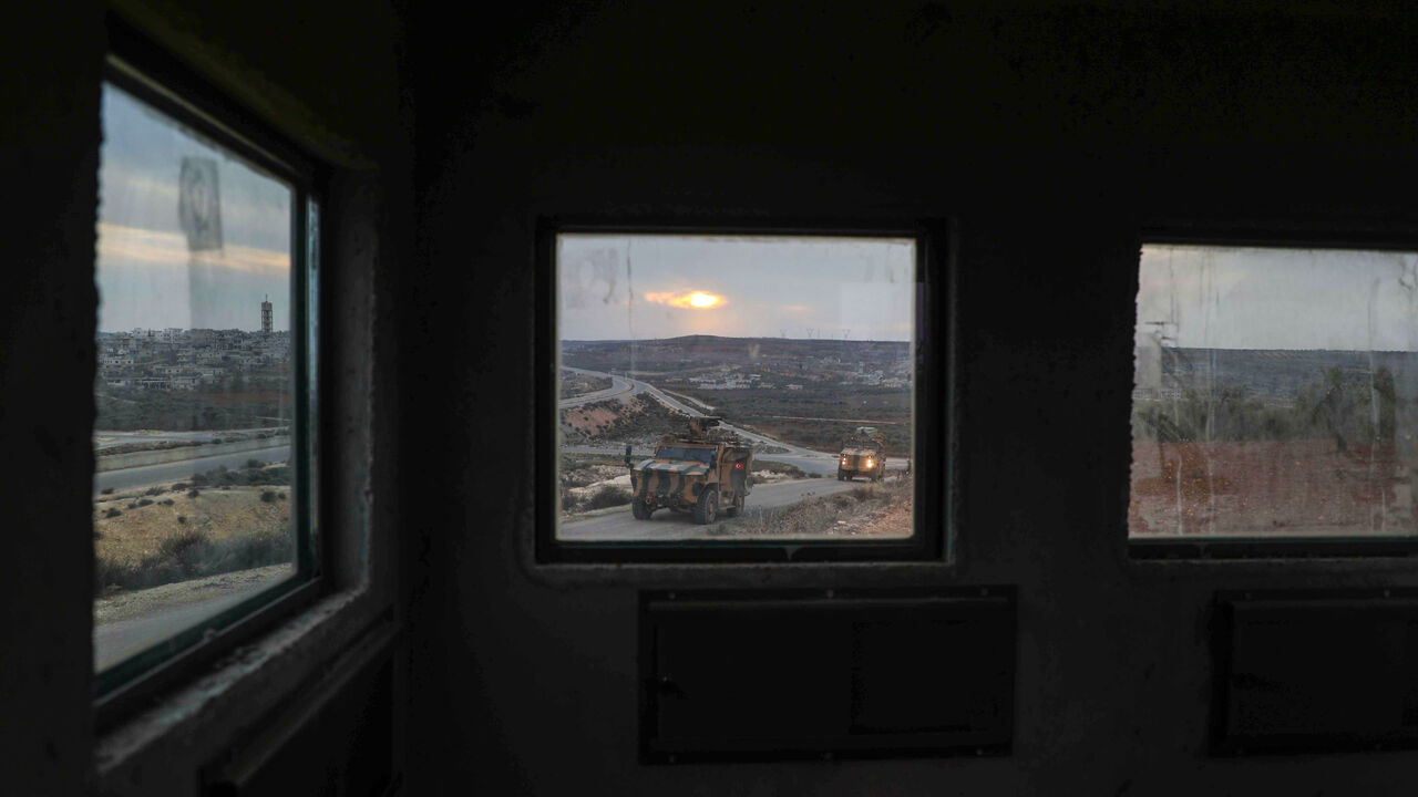 1230422071 A concrete box placed by the Turkish Army, for use as a guard point, is pictured overlooking the M4 highway near the town of Ariha in Syria's rebel-held northwestern Idlib province on January 4, 2021. (Photo by AAREF WATAD / AFP) (Photo by AAREF WATAD/AFP via Getty Images)