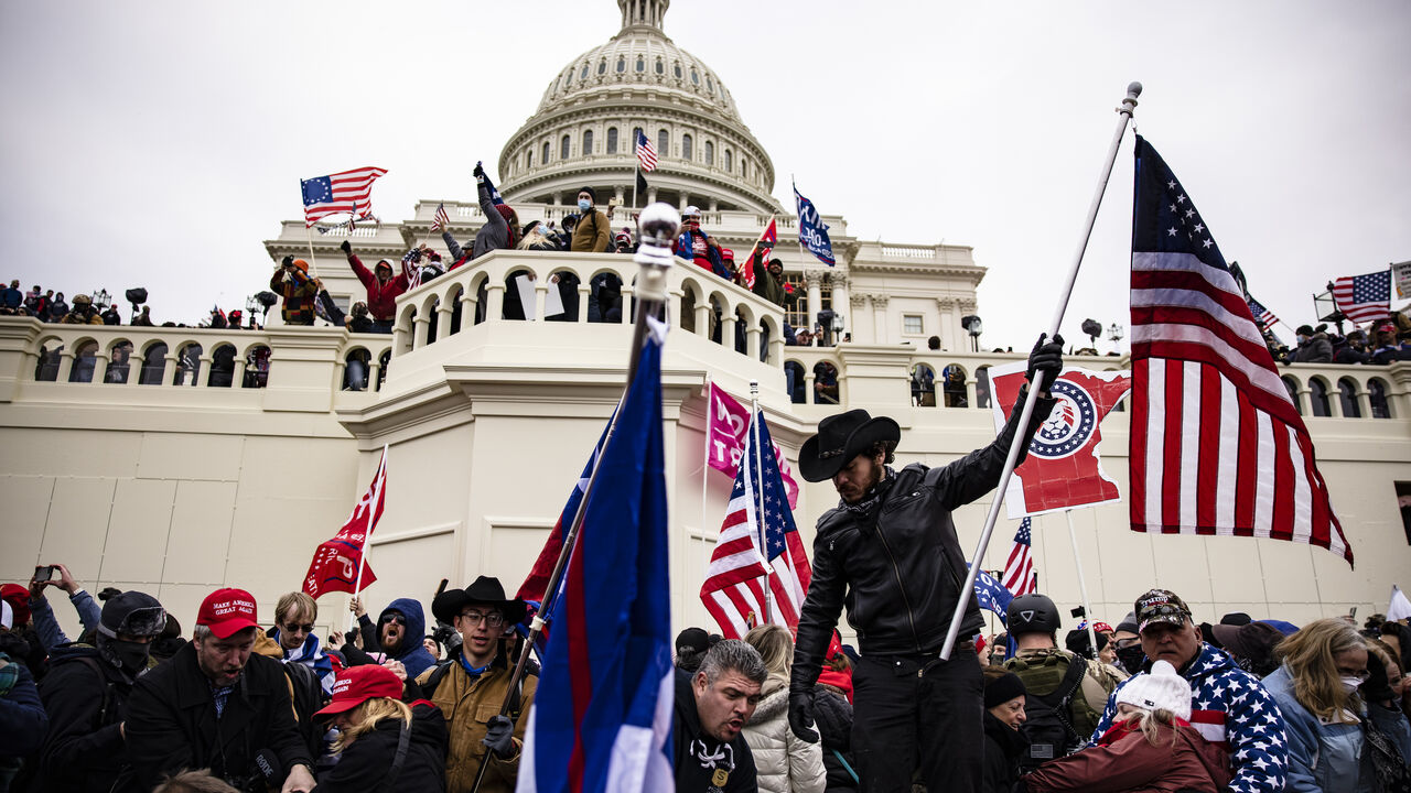 1230454306 WASHINGTON, DC - JANUARY 06: Pro-Trump supporters storm the US Capitol following a rally with President Donald Trump on January 6, 2021 in Washington, DC. Trump supporters gathered in the nation's capital today to protest the ratification of President-elect Joe Biden's Electoral College victory over President Trump in the 2020 election. (Photo by Samuel Corum/Getty Images)