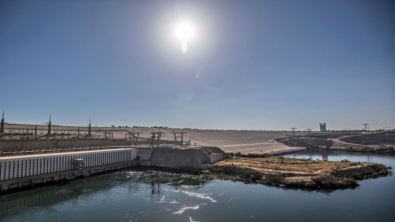 1230517878 A general view shows Egypt's High Dam in Aswan, some 920 kilometres south of the capital Cairo, on January 3, 2021. - Half a century since Egypt's Aswan dam was inaugurated to much fanfare, harnessing the Nile for hydropower and irrigation, the giant barrier is still criticised its human and environmental toll. But it is also a stark reminder -- amid high tensions today as Addis Ababa fills its collosal Grand Ethiopian Renaissance Dam (GERD) upstream, Africa's largest -- of just how volatile politics over t