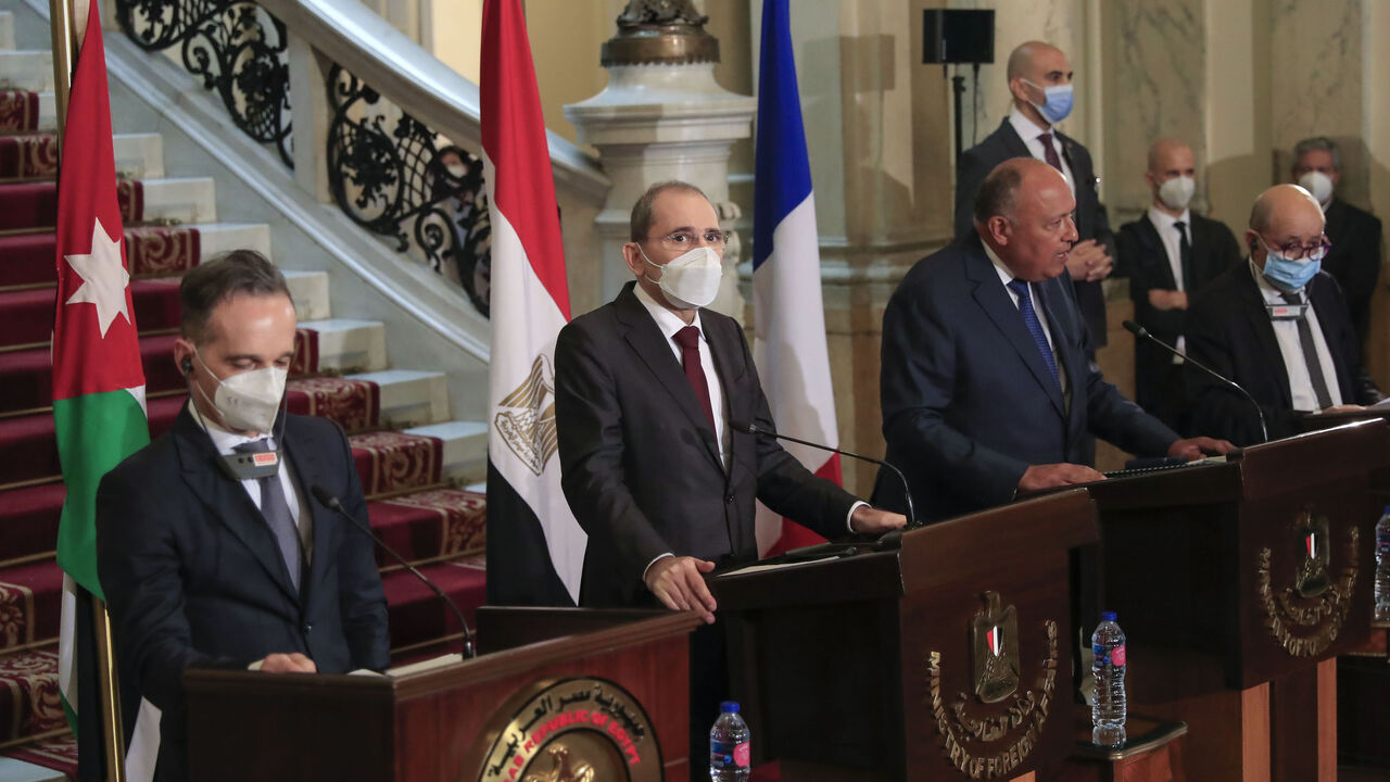 1230532510 Foreign Ministers of (L to R) Germany Heiko Maas, Jordan Ayman Safadi, Egypt Sameh Shoukry, and France Jean-Yves Le Drian, hold a joint press conference after a meeting to discuss the Middle East peace process, in the Egyptian capital Cairo, on January 11, 2021. (Photo by Khaled DESOUKI / AFP) (Photo by KHALED DESOUKI/AFP via Getty Images)