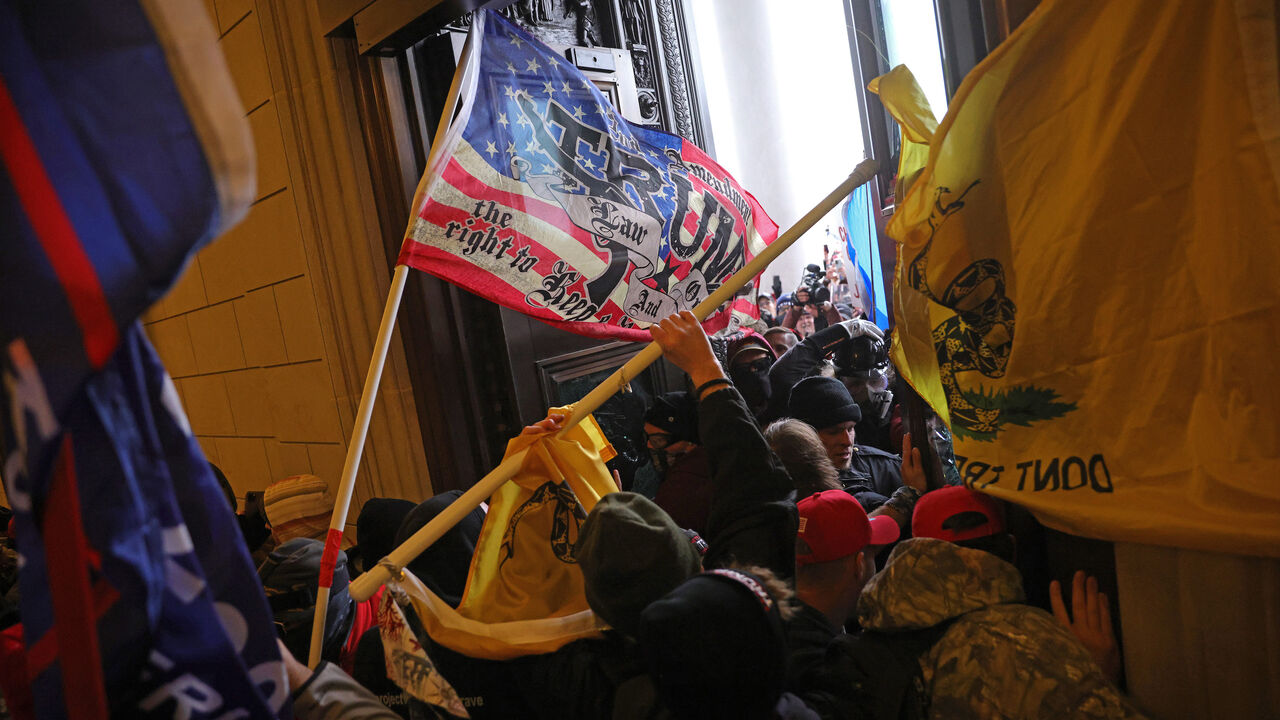 1294935650 WASHINGTON, DC - JANUARY 06: Protesters supporting U.S. President Donald Trump break into the U.S. Capitol on January 06, 2021 in Washington, DC. Congress held a joint session today to ratify President-elect Joe Biden's 306-232 Electoral College win over President Donald Trump. Pro-Trump protesters entered the U.S. Capitol building during demonstrations in the nation's capital. (Photo by Win McNamee/Getty Images)