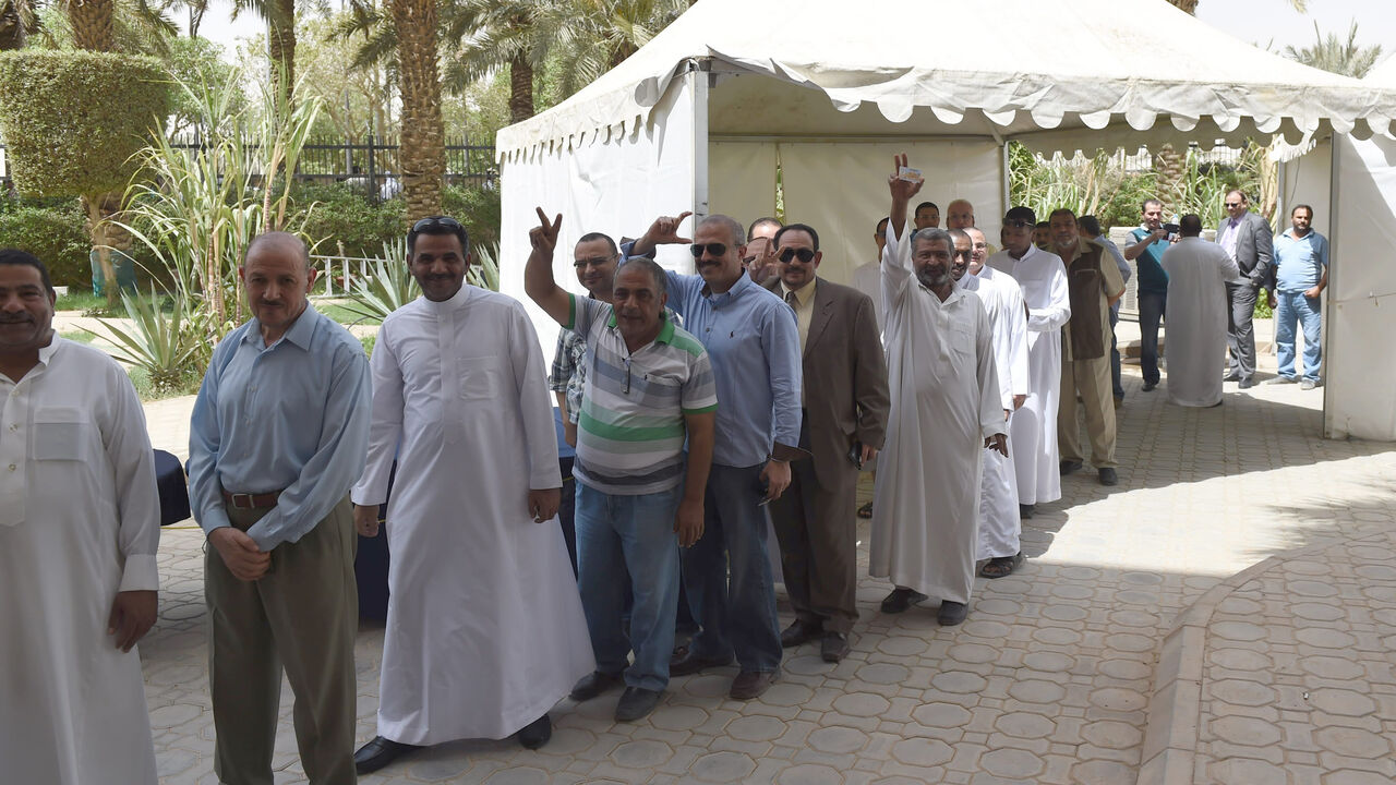 490770157 Egyptian men living in Saudi Arabia queue to casts their ballots in the early voting for the presidential elections on May 26-27, at the Egyptian embassy in Riyadh, on May 15, 2014. Egyptians abroad started voting in their country's first presidential elections since the military deposed Islamist president Mohamed Morsi nearly a year ago. Around 680,000 Egyptians, in 124 countries have registered to vote and have until May 18, to cast their ballots at diplomatic missions in their countries of residence, sta