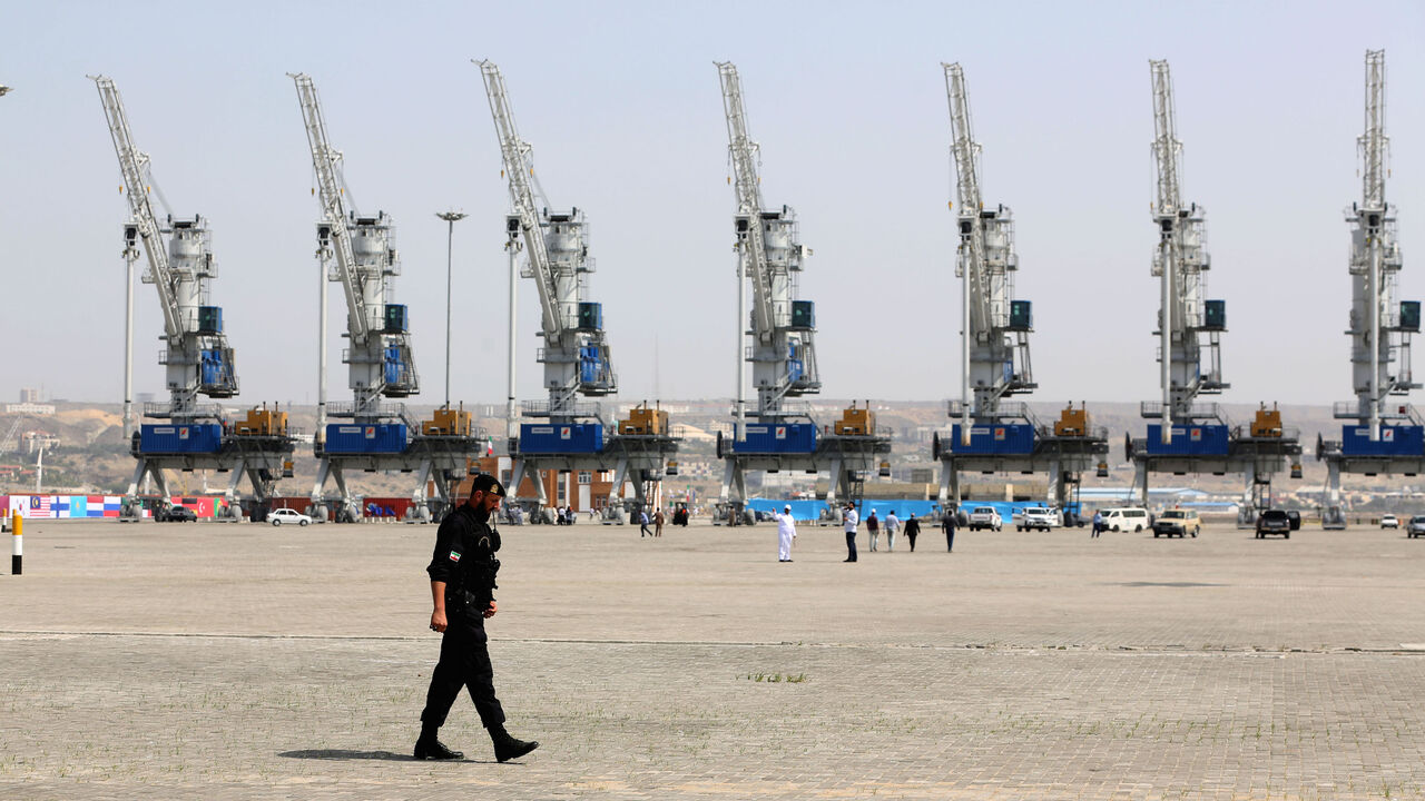 1127383639 A police officer walks around during an inauguration ceremony of new equipment and infrastructure at Shahid Beheshti Port in the southeastern Iranian coastal city of Chabahar, on the Gulf of Oman, on February 25, 2019. (Photo by ATTA KENARE / AFP) (Photo credit should read ATTA KENARE/AFP via Getty Images)