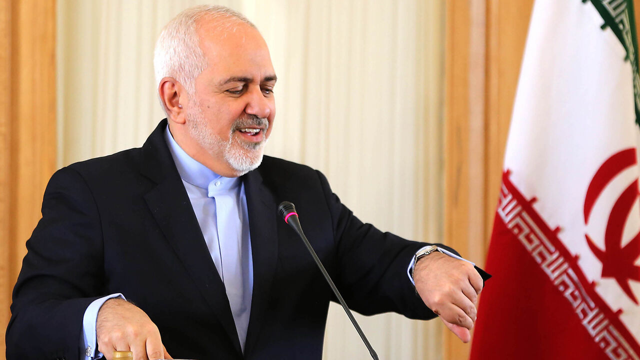 1127421120 This picture taken on February 13, 2019 shows Iran's Foreign Minister Mohammad Javad Zarif checks his watch during a press conference in Tehran. - Zarif, who was the lead negotiator in the 2015 nuclear deal, announced his resignation on Instagram on February 25, 2019. "I apologise for my inability to continue serving and for all the shortcomings during my term in office," Zarif said in message posted on his verified Instagram account. (Photo by ATTA KENARE / AFP) (Photo credit should read ATTA KENARE