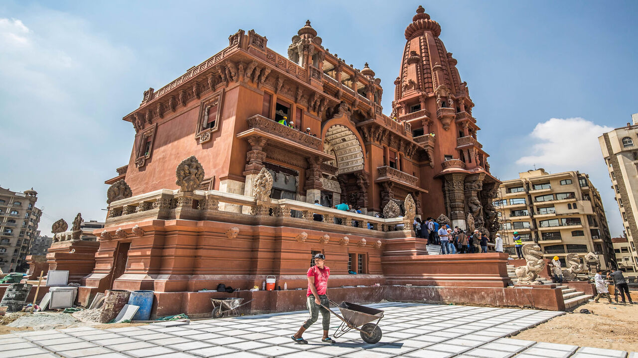 1162367779 This picture taken on August 18, 2019 shows restoration works ongoing at the historic "Le Palais Hindou" (also known as the "Baron Empain Palace") built by in the early 20th century by Belgian industrialist Edouard Louis Joseph, Baron Empain, in the classical Khmer architectural style of Cambodia's Angkor Wat, in the Egyptian capital Cairo's northeastern Heliopolis district. (Photo by Khaled DESOUKI / AFP) (Photo credit should read KHALED DESOUKI/AFP via Getty Images)