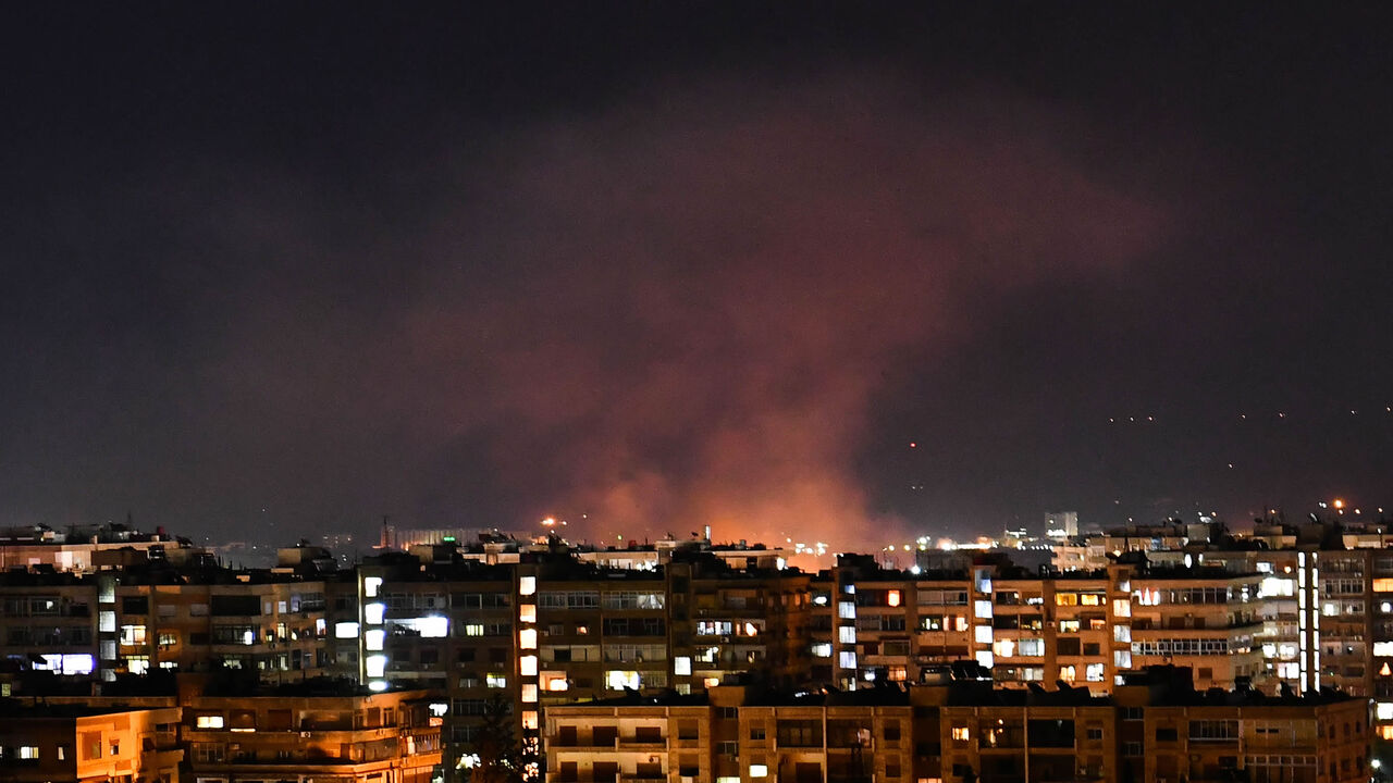 1227713437 Smoke billows following an Israeli airstrike targeting south of the capital Damascus, on July 20, 2020. - Israeli strikes south of the Syrian capital wounded seven Syrian soldiers, state media reported, in an attack which a war monitor said hit several positions of regime forces and Iran-backed militias. (Photo by STR / AFP) (Photo by STR/AFP via Getty Images)