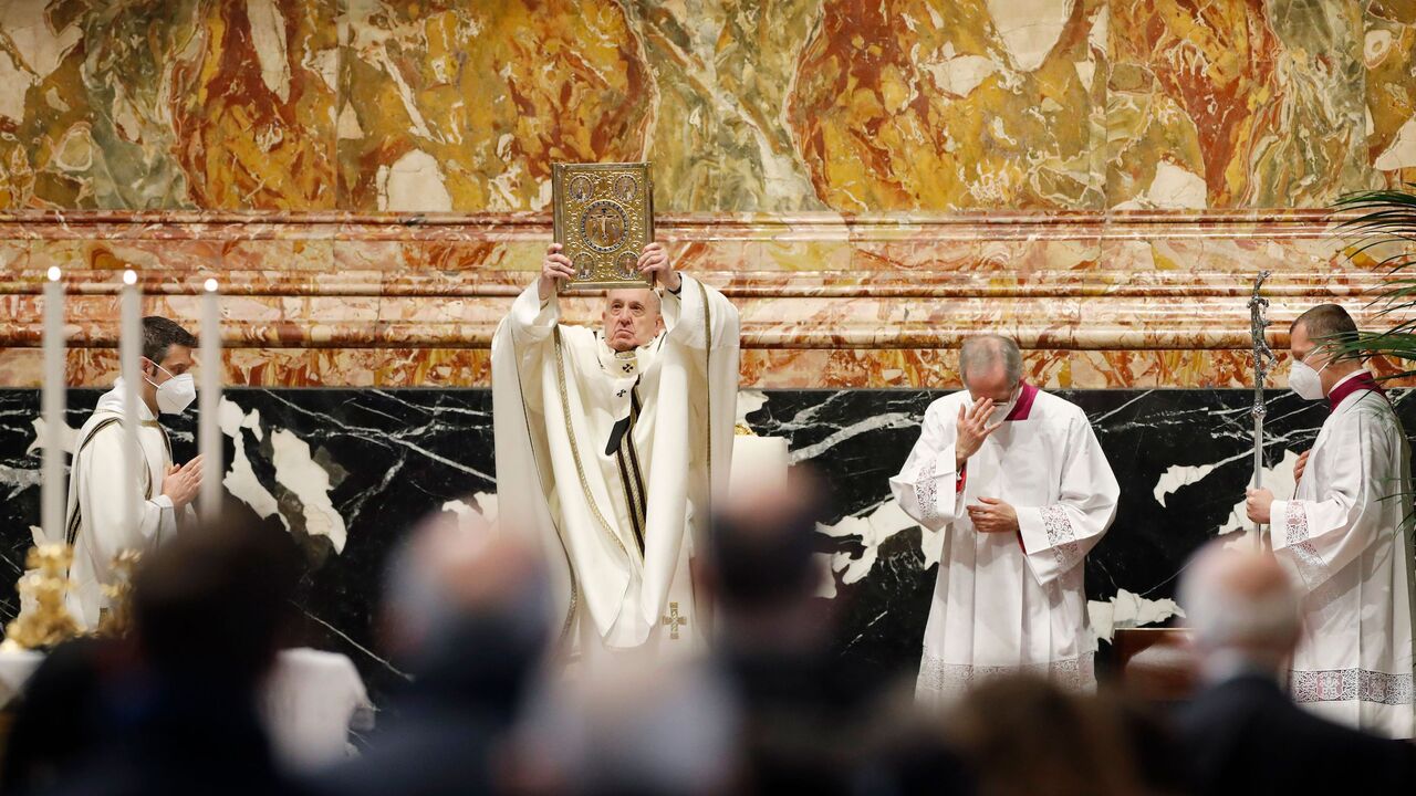 1230445291 Pope Francis holds the Holy Book of Prayers as he celebrates Mass for the Epiphany on January 6, 2021 at St. Peter's Basilica in the Vatican. (Photo by REMO CASILLI / POOL / AFP) (Photo by REMO CASILLI/POOL/AFP via Getty Images)
