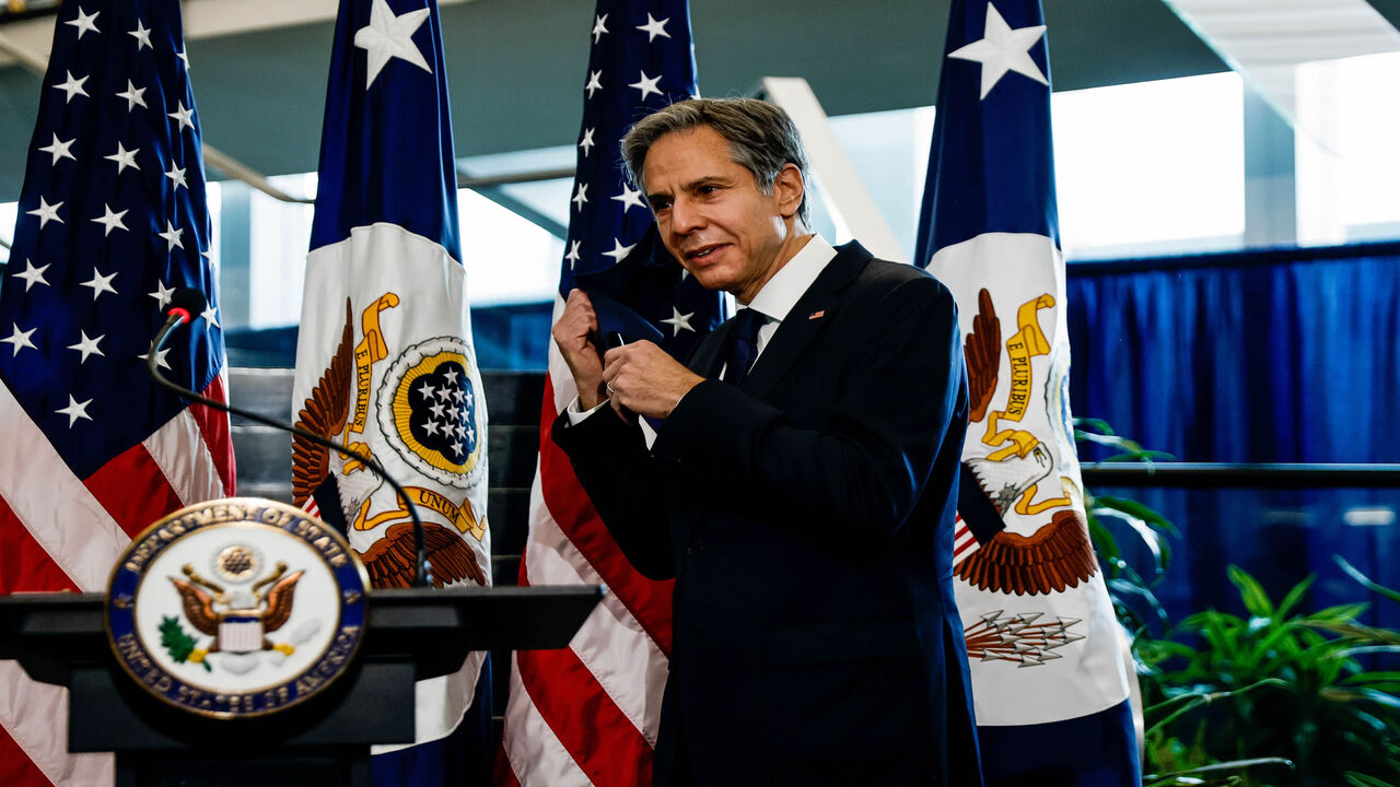 1230815923 Newly confirmed US Secretary of State Antony Blinken removes his face mask to speak during a welcome ceremony at the State Department in Washington,DC on January 27, 2021. - (Photo by CARLOS BARRIA / POOL / AFP) (Photo by CARLOS BARRIA/POOL/AFP via Getty Images)