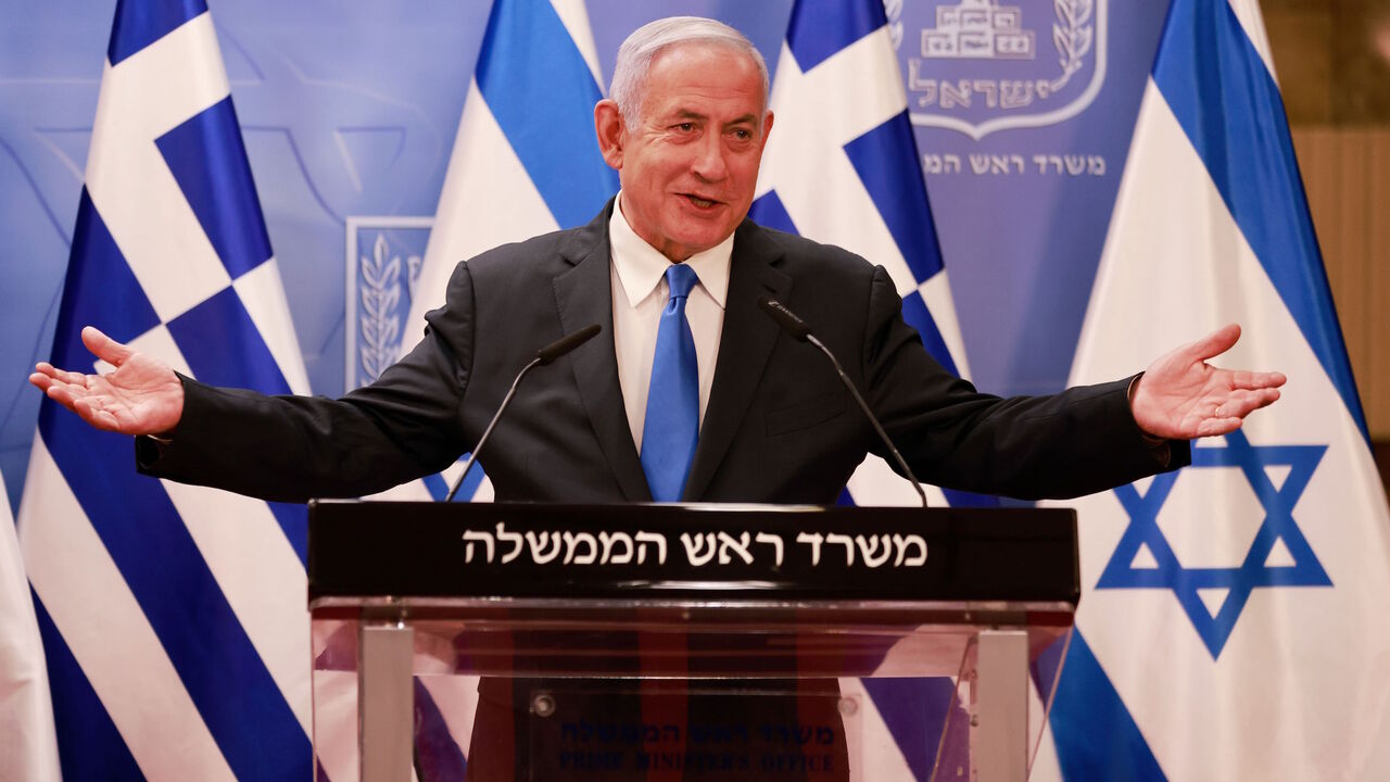 1231046957 Israeli Prime Minister Benjamin Netanyahu delivers a statement next to the Greek Prime Minister Kyriakos Mitsotakis (unseen) after their meeting in the Prime Minister's office in Jerusalem on February 8, 2021. (Photo by menahem kahana / POOL / AFP) (Photo by MENAHEM KAHANA/POOL/AFP via Getty Images)