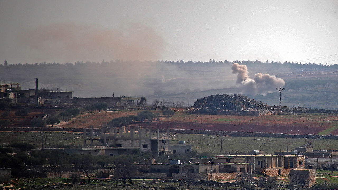 1231119770 Smoke billows following reported shelling by government forces on the northwestern Syrian town of Barah, in the rebel held Idlib province on February 12, 2021. (Photo by Abdulaziz KETAZ / AFP) (Photo by ABDULAZIZ KETAZ/AFP via Getty Images)