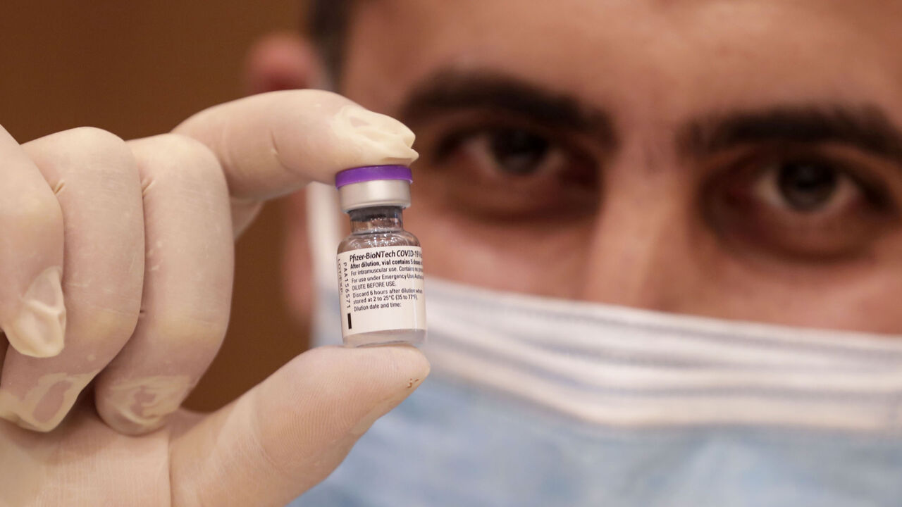 1231156292 A medic prepares a dose of the COVID-19 Pfizer/BioNTech vaccine at Lebanon's American University Medical Center in the capital Beirut, on February 14, 2021, as the country kickstarts its inoculation campaign. - Lebanon gave its first COVID-19 vaccine dose to a doctor, as it started inoculation it hopes will keep the pandemic in check amid a deepening economic crisis. (Photo by ANWAR AMRO / AFP) (Photo by ANWAR AMRO/AFP via Getty Images)