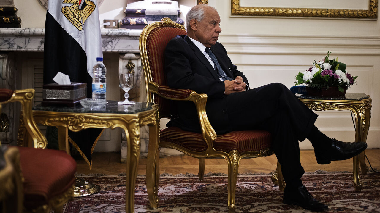 451688697 Egypt's interim prime minister Hazem Beblawi gives an interview to a journalist from the Agence France-Presse at his office in Cairo on November 24, 2013 as Egypt's interim president approved a controversial law regulating demonstrations. "It is not a law that limits the right to demonstrate, but it aims at protecting the right of protesters," Beblawi said. AFP PHOTO/GIANLUIGI GUERCIA (Photo credit should read GIANLUIGI GUERCIA/AFP via Getty Images)