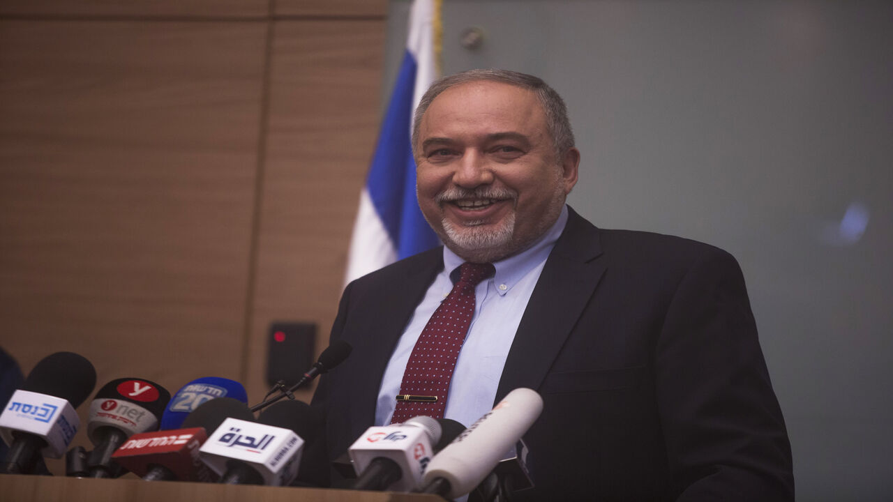 1061415826 JERUSALEM, ISRAEL - NOVEMBER 14: (ISRAEL OUT) Israeli Defense Minister Avigdor Lieberman smiles during a press conference at the Israeli Parliament on November 14, 2018 in Jerusalem, Israel. Lieberman has announced his resignation as Defense Minister of Israel as a protest against the cease-fire Israel agreed to with Hamas following recent heavy rocket fire targeting Israel from Gaza Strip. (Photo by Lior Mizrahi/Getty Images)
