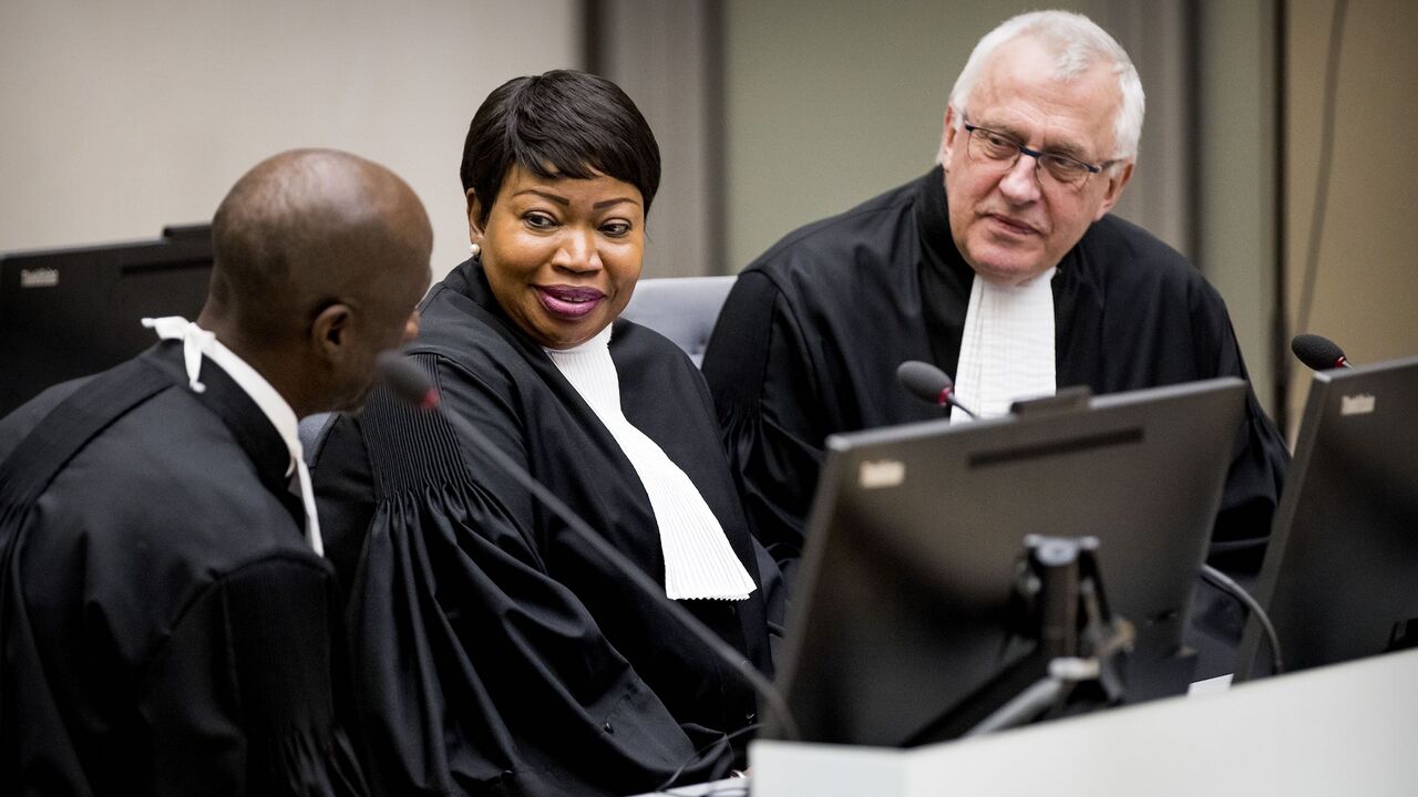 1088474050 International Criminal Court (ICC) chief prosecutor Fatou Bensouda (C) and deputy prosecutor James Stewart (R) attend the initial appearance before judges of member of the board of the Confederation of African Football (CAF), Patrice-Edouard Ngaissona of the Central African Republic, at the ICC in The Hague on January 25, 2019, following his extradition from France on charges of war crimes and crimes against humanity. - Ngaissona is charged with coordinating so-called anti-Balaka militia which emerged after