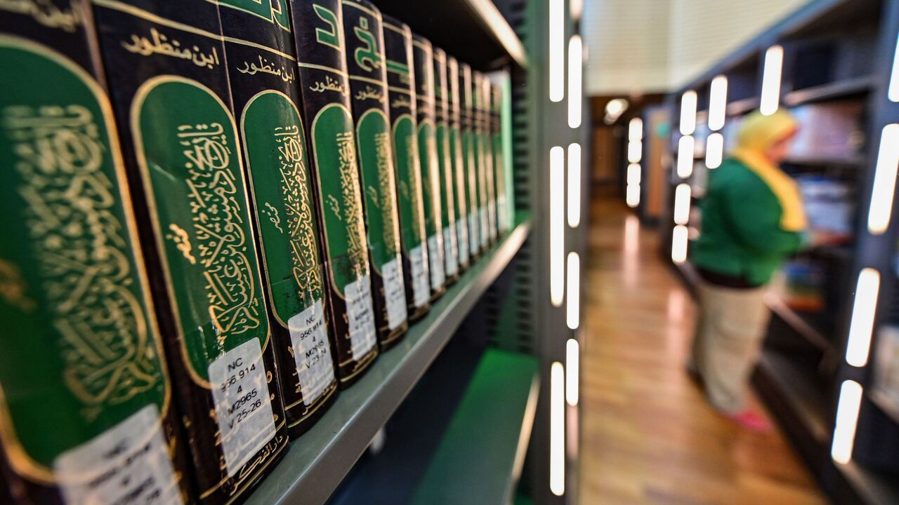 1151938295 A photo taken on June 24, 2019 shows a stack of books as part of the collection of the "History of Damascus" summary volumes by the medieval Sunni Muslim scholar Ibn Asakir, on a shelf in the main building of the Bibliotheca Alexandrina library in Egypt's northern coastal city of Alexandria. - The Bibliotheca, established in 2002, serves as a modern-day commemoration of the Library of Alexandria of antiquity, and a modern-day public library and educational centre. (Photo by GIUSEPPE CACACE / AFP) (Ph