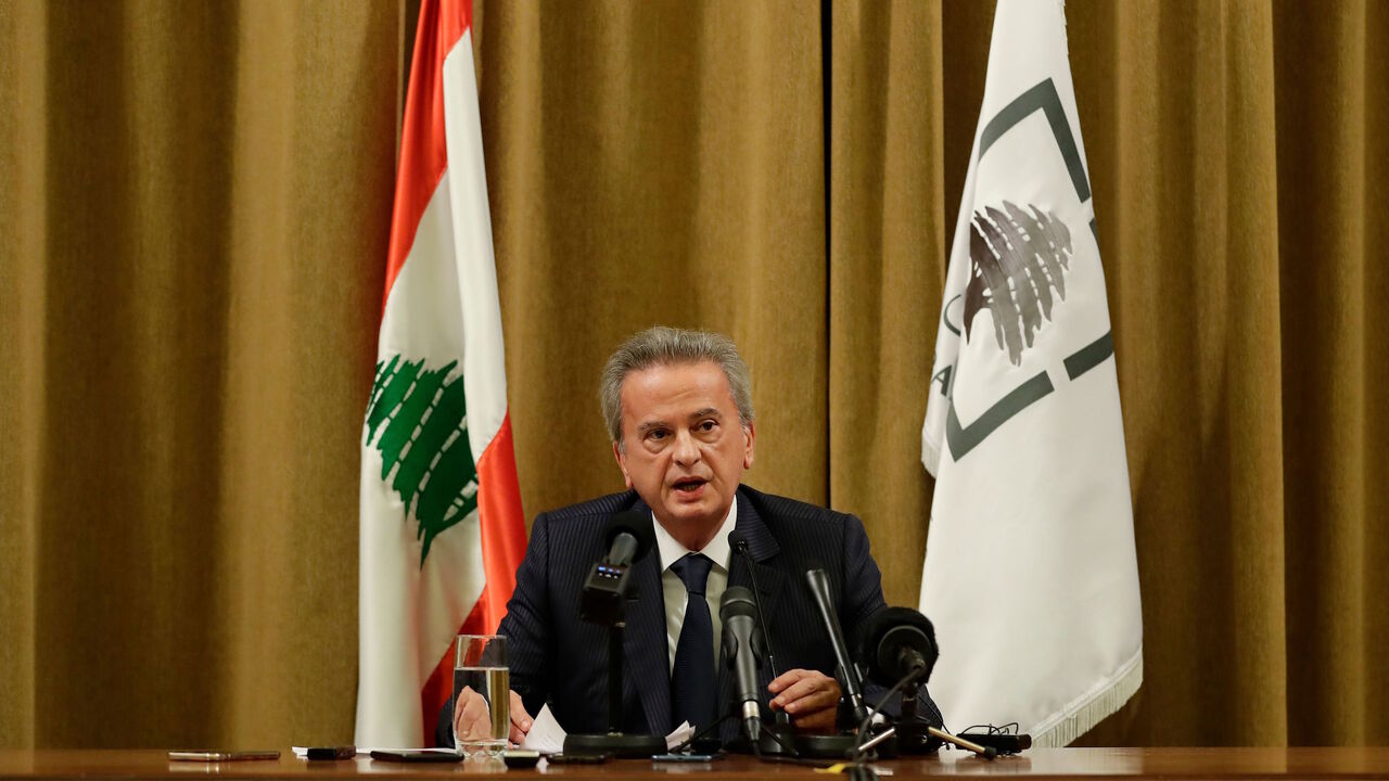 1181661625 Lebanon's Central Bank Governor Riad Salameh speaks during a press conference at the bank's headquarters in Beirut on November 11, 2019. - Lebanon's central bank said it would strive to maintain the local currency's peg to the dollar and ease access to the greenback after weeks of mass protests. For two decades, the Lebanese pound has been pegged to the greenback at around 1,500 pounds to the dollar, and both currencies have been used interchangeably in daily life. (Photo by JOSEPH EID / AFP) (Photo by JOSE