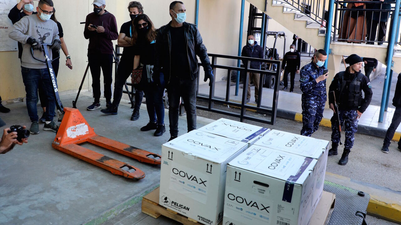 1231764947 A worker unloads a refrigerated truck carrying the first delivery of coronavirus vaccine via the United Nations Covax programme supporting poorer areas, to be kept at Palestinian Authority's storage facility in the West Bank city of Nablus, on March 17, 2021. - The Palestinian Authority said that vaccination would begin at the end of this week, primarily for those aged over 75, cancer patients and medical personnel.
Earlier, some 60,000 doses of Pfizer and AstraZeneca vaccines allocated to the Palestinians