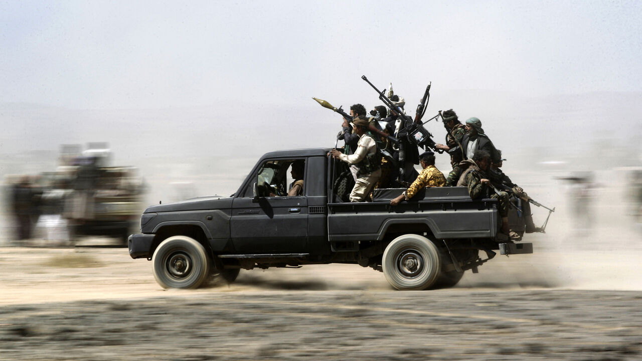 619823656 TOPSHOT - Armed Yemeni tribesmen loyal to the Shiite Huthi rebels sit in the back of an armed vehicle during a gathering to mobilise more fighters into several battlefronts on November 1, 2016 on the outskirts of the capital Sanaa.
The war in Yemen escalated in March 2015 when the Saudi-led coalition launched a military campaign to push back the Huthi rebels, after they seized the capital in 2014 and then advanced on other parts of Yemen.
/ AFP / MOHAMMED HUWAIS (Photo credit should read MOHAMMED