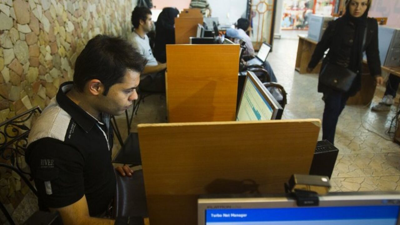 To match Feature IRAN-INTERNET/ Customers use computers at an internet cafe in Tehran May 9, 2011. Websites like Facebook, Twitter, YouTube and countless others were banned shortly after the re-election of Iran's President Mahmoud Ahmadinejad and the huge street protests that followed. Seen by the government as part of a "soft war" waged by the enemies of the Islamic Republic, social networking and picture sharing sites were a vital communication tool for the anti-Ahmadinejad opposition -- more than a year before they played a similar rol