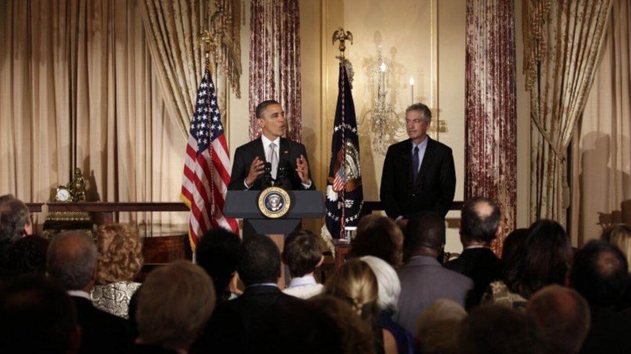 U.S. President Barack Obama delivers remarks next to Deputy Secretary of State William Burns at the Diplomatic Corps holiday reception at the State Department in Washington U.S. President Barack Obama delivers remarks next to Deputy Secretary of State William Burns at the Diplomatic Corps holiday reception at the State Department in Washington December 19, 2012. REUTERS/Yuri Gripas (UNITED STATES - Tags: POLITICS) - RTR3BRHD