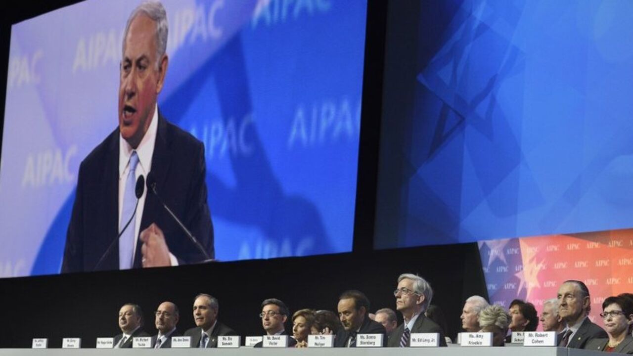 Israeli Prime Minister Benjamin Netanyahu addresses AIPAC in Washington Israeli Prime Minister Benjamin Netanyahu (on the monitor) addresses the American Israel Public Affairs Committee (AIPAC), as board members listen, in Washington, March 4, 2014. Netanyahu urged world powers on Tuesday not to allow Iran to retain the ability to enrich uranium, saying it must be stripped of all nuclear technologies with bomb-making potential. REUTERS/Mike Theiler (UNITED STATES - Tags: POLITICS) - RTR3G175