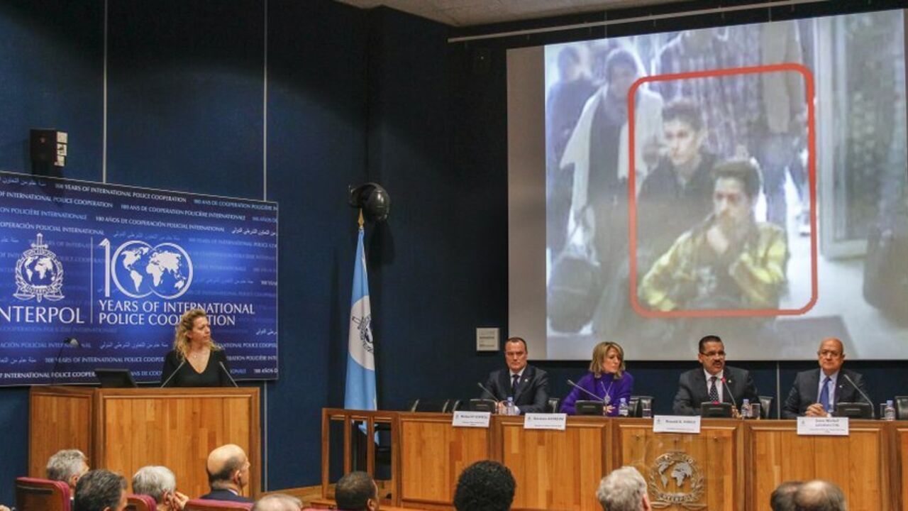 Interpol Secretary General Ronald Noble speaks during a news conference at the Interpol headquarters in Lyon Interpol Secretary General Ronald Noble (2ndR) speaks during a news conference at the Interpol headquarters in Lyon, March 11, 2014. The head of international police agency Interpol said on Tuesday he did not believe the disappearance of a Malaysia Airlines plane at the weekend was a terrorist incident, suggesting two men who boarded using stolen passports may have been smuggled by traffickers. The plane carrying 239 people on board has now been missing for four days, with a search involving crews from 10 n