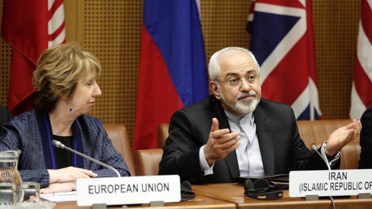 EU Foreign Policy Chief Ashton and Iranian Foreign Minister Javad Zarif wait for the begin of talks in Vienna European Union Foreign Policy Chief Catherine Ashton (L) and Iranian Foreign Minister Mohammad Javad Zarif wait for the begin of talks in Vienna June 17, 2014. Six world powers and Iran began their fifth round of nuclear negotiations on Tuesday in hopes of salvaging prospects for a deal over Tehran's disputed atomic activity by a July deadline. REUTERS/Heinz-Peter Bader (AUSTRIA - Tags: POLITICS ENERGY) - RTR3U83Y