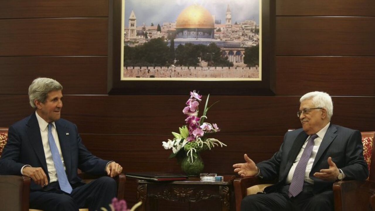Palestinian President Abbas and U.S. Secretary of State Kerry meet in Ramallah Palestinian President Mahmoud Abbas (R) gestures during a meeting with U.S. Secretary of State John Kerry in the West Bank city of Ramallah July 19, 2013. REUTERS/Fadi Arouri/Pool (WEST BANK - Tags: POLITICS) - RTX11S3S
